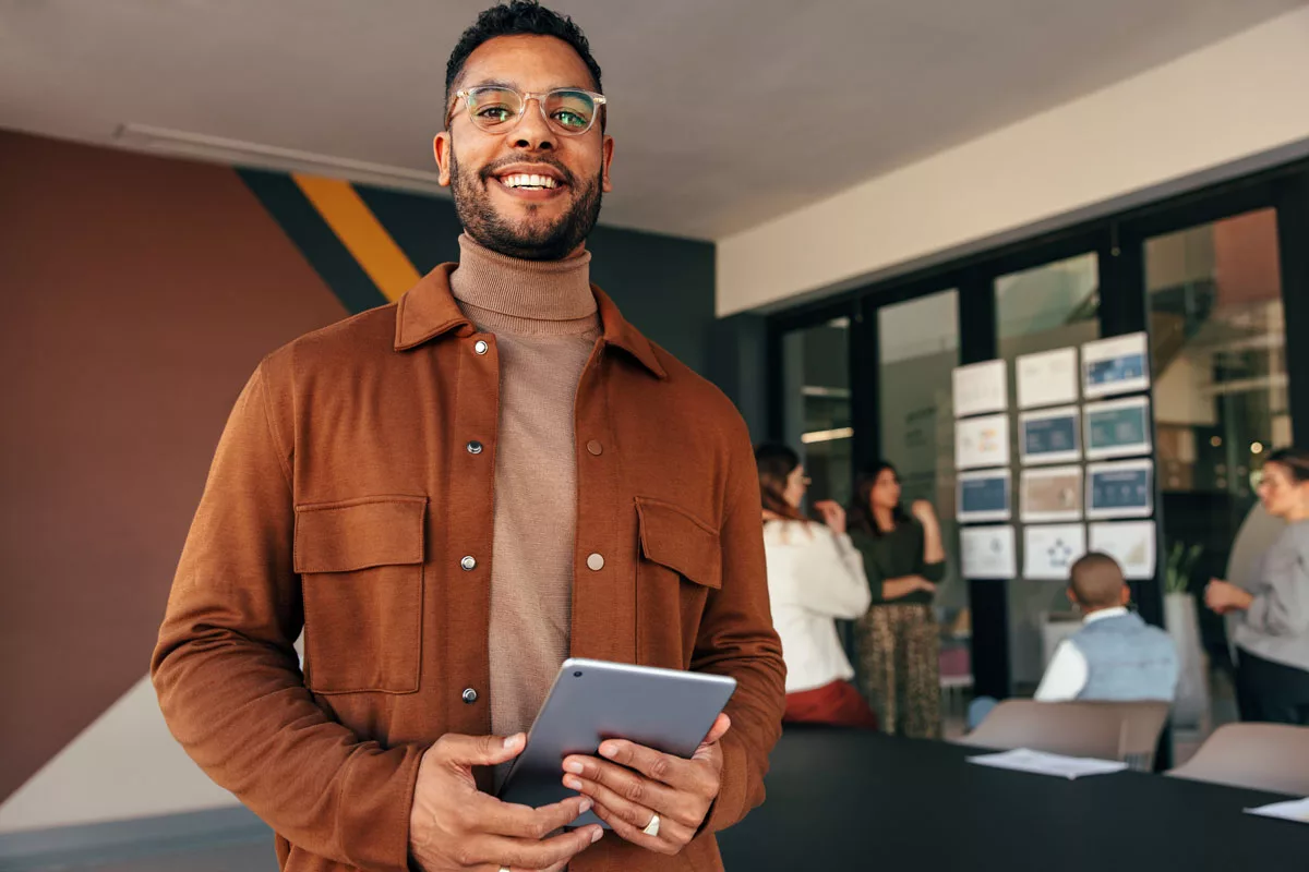 smiling-man-holding-tablet